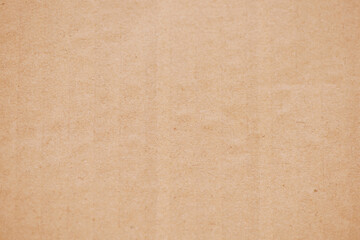 Fototapeta na wymiar Brown corrugated cardboard texture background. Brown paper cardboard with soft color. Brown corrugated cardboard texture is useful as a background.