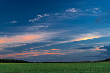 blue and orange sunset over green field in Worcestershire countryside