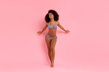 Beautiful woman in stylish bikini posing on pink background - obrazy, fototapety, plakaty