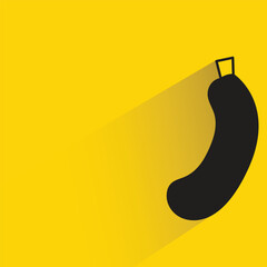 cucumber with shadow on yellow background