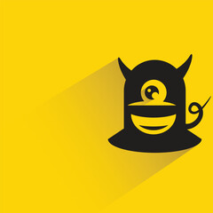 funny monster with shadow on yellow background