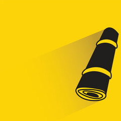 mat roll with shadow on yellow background