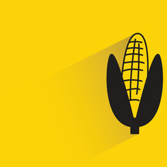 corn with shadow on yellow background