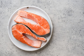 raw salmon steaks on a plate