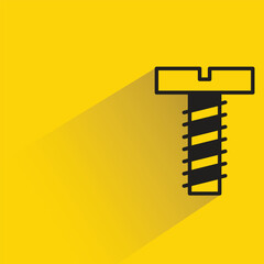 screw nail with shadow on yellow background