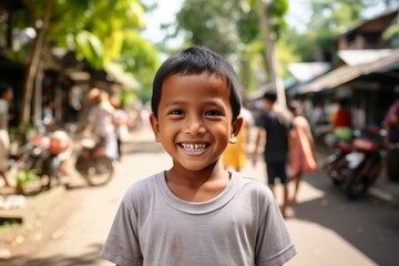 An indonesian boy kid smile at camera