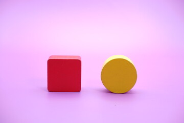 Set of colorful wooden shape toy. Square and round on purple background