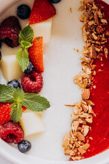 Sweet milk semolina porridge with strawberries on beautiful plate. Delicious breakfast for children