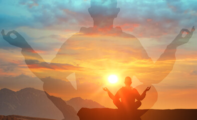 silhouette man in lotus position. practicing yoga outdoors. Harmony, self care, relaxation...