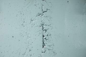 Texture of gray concrete wall with cracks