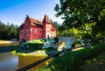 Obraz premium The Small, Charming Cervena Lhota Castle in a Lake in South Bohemia in the Czech Republic