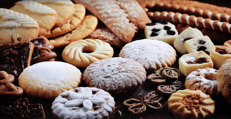 Fototapeta na wymiar still life of cookies with chocolate on a wooden table, dark background, delicious pastries