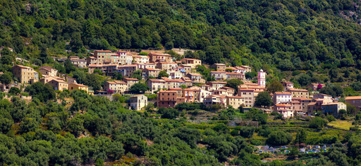 Fototapeta na wymiar The Village of Ota on Corsica Set in a Hillside in the Mountains near the Gulf of Porto