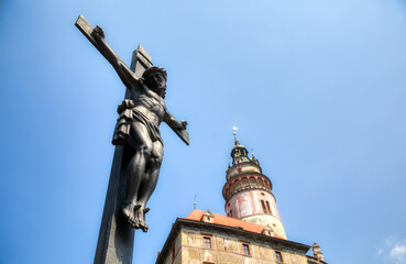 Crucifix on a Bridge Crossing the Vltava River in Beautiful Cesky Krumlov, with the Famous Castle
