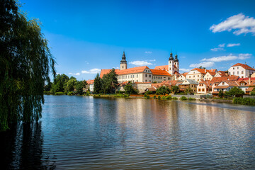View towards the Castle of Telc in the Czech Republic, with the Name of Jesus Church and the Tower of the Church of St James