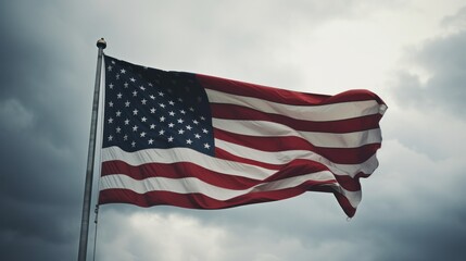 Fototapeta premium Anti-Trump Protest with American Flag Fluttering in the Wind Under Cloudy Skies