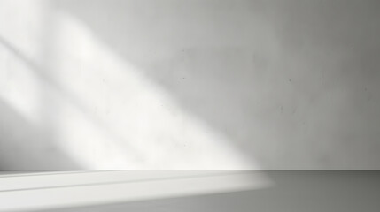 Minimal abstract light gray background for product presentation. Shadow and light from windows on plaster wall.