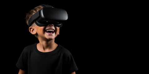 Young boy getting experience using VR headset glasses isolated on a black background with copy space