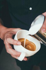 person holding a cup of coffee