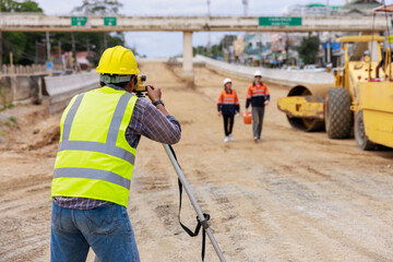 Engineer use theodolite equipment for route surveying to build a bridge