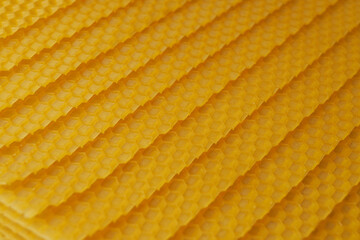 Seamless pattern of natural beeswax sheets on background. Banner. Top view, flat lay.