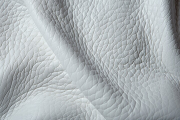 white leather  textures. retro atmosphere, nostalgic trend of Y2K. trend tactile, touching causes emotions concept. - obrazy, fototapety, plakaty