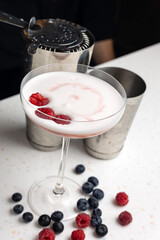 Alcoholic berry cocktail with raspberries 
