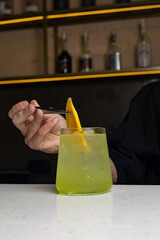 Alcoholic drink with citrus slices at the bar 