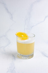 Alcoholic drink with citrus slices at the bar 