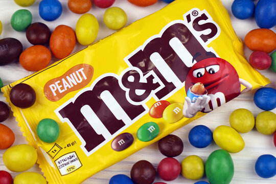 KHARKIV, UKRAINE - JANUARY 2, 2021 M and Ms colorful button shaped chocolate candies. Multi colored chocolates each of which has the letter m printed in lower case in white on one side