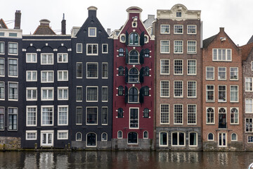 Typical gabled houses on Damrak street in Amsterdam, Holland, Netherlands