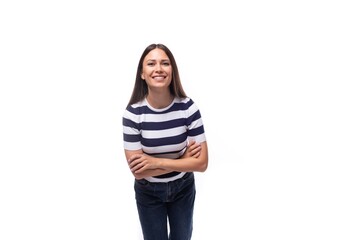 young european lady with black even hair dressed in a striped t-shirt laughs