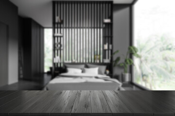 Empty wooden table on background, home interior with bed and decoration. Mockup