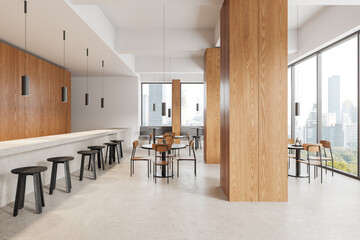 Cozy cafeteria interior with dining table in row and counter, panoramic window