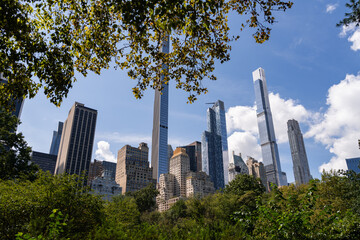 Fototapeta na wymiar New York central park and business skyscrapers under daylight sky