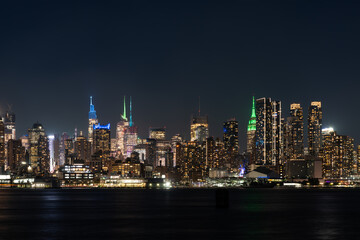 Fototapeta na wymiar New York Hudson Yards skyline at night with lights, panoramic skyscrapers