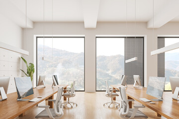Cozy office interior with pc computers and armchairs in row, panoramic window