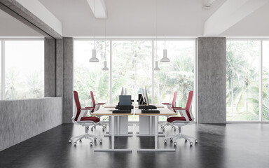 Modern office interior with pc desktop and chairs near panoramic window