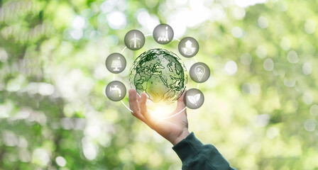 Hand of human holding green world with eco environment icon, Save world, technology sustainable alternative environment concept. Energy of natural gas sustainable and business on green background.