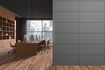 Stylish office interior with pc monitors and shelf, window. Copy space wall