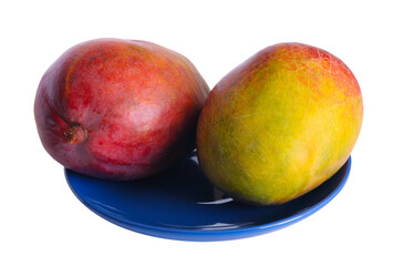 Red ripe sweet juicy delicious mango on a blue plate, isolated on white background