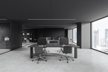 Grey coworking interior with pc computers and seats near panoramic window