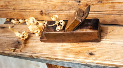 Purchased (consumer goods)Plane with shavings close-up