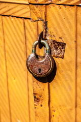 Purchased (consumer) antique lock on the garage door close-up