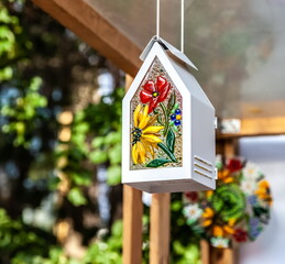 Purchased (consumer) Painted Bird feeder close-up
