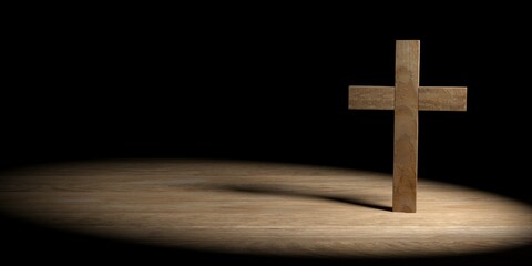 Wooden Jesus Christ christian crucifix or cross standing on wood table on black background with copy space, god, resurrection or christianity concept