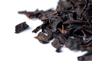 Heap of  black tea isolated on white background