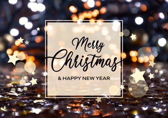 Merry Christmas and Happy New Year greeting card on bokeh shiny golden background stock photo images. Merry Christmas & Happy New Year inscription in a frame on a shiny golden starry bokeh background