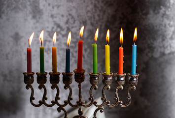 Jewish religious holiday Hanukkah with holiday Hanukkah (traditional candelabra) and dreidel on a...