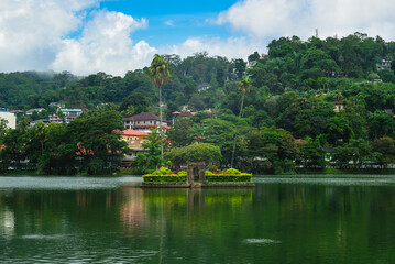 Fototapeta na wymiar Diatilaka Mandapa Island in kandy lake at Kandy, the former capital of sri lanka